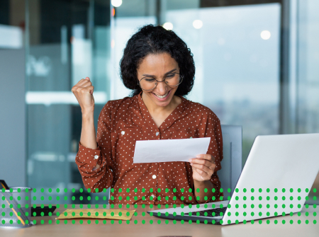 PROFESSIONAL BUSINESS LOANS MADE EASY | GET CAPITAL FOR YOUR BUSINESS - photo graphics woman at offices desk with laptop on it holding a letter