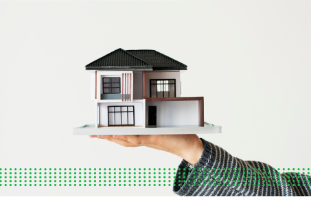 ASSETS CAN BE CRUCIAL TO SECURING A LOAN - photo graphics model house on palm of the hand
