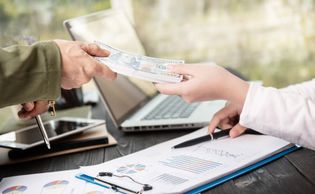 SMALL BUSINESS LOANS & OTHER FINANCING OPTIONS FOR SMALL BUSINESS OWNERS - photo graphics person signing contract and receiving stack of dollar bills