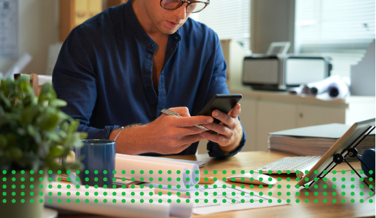 RESIDENTIAL LOAN RATES - photo graphics man sitting at desk looking at phone