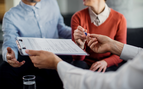 HOME LOAN PRE-APPROVAL - photo graphics woman given pen to sign home loan contract