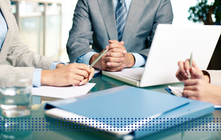 CORPORATE LOAN VS. COMMERCIAL LOAN - photo graphics people having discussion at office table