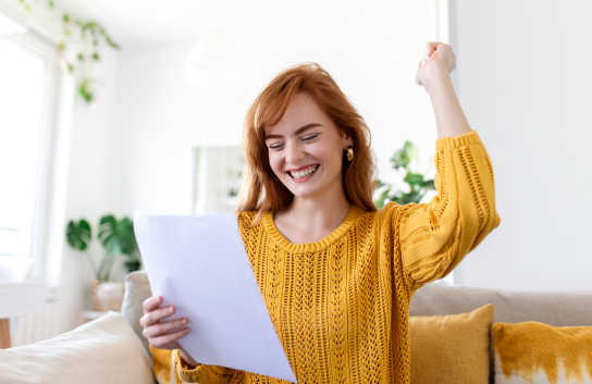 GET A PERSONAL LOAN FOR HOME IMPROVEMENT - photo graphics woman cheering holding paper