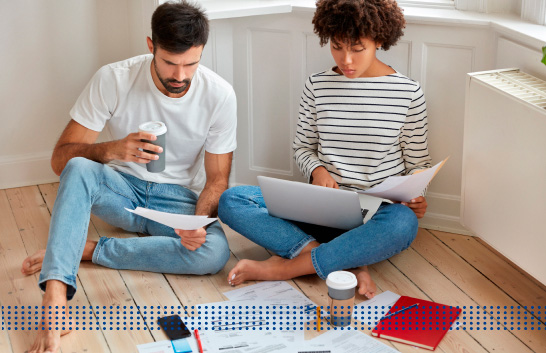 HOME LOANS FOR BAD CREDIT - photo graphics couple sitting on floor holding paper and laptop