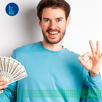 HOW TO GET LOANS WITH LOW INTEREST RATES - photo graphics man holding dollar bills showing ok sign