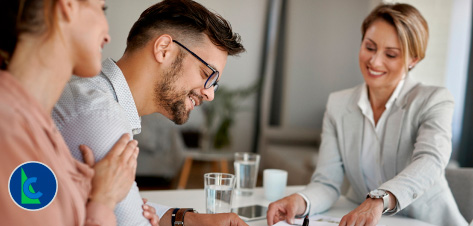 HOW DO COMMERCIAL LOANS DIFFER FROM TRADITIONAL LOANS? - photo graphics couple singing documents at table