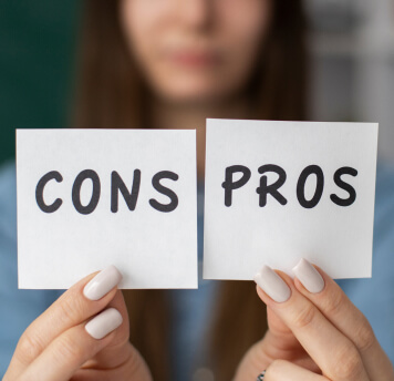 PROS & CONS OF A SECURED BUSINESS LOAN - photo graphics woman holding paper with cons and pros written on it